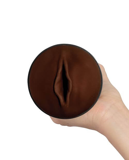 A head-on view of the orifice/entrance of the KIIROO RealFeel Generic Vulva stroker. It looks like a vulva with the inner labia as the prominant feature. There is no clear clitoris on it. | Kinkly Shop