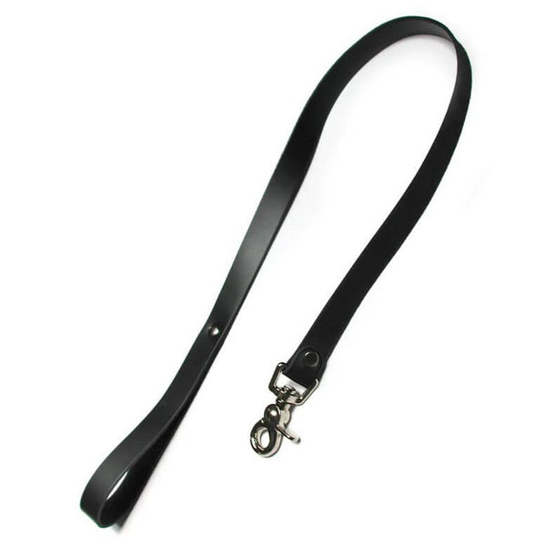 Kinklab Bondage Basics Leather Leash up against a plain white background. It looks like a single, long strip of leather with a looped handle (fastened by a rivet) on one end. On the opposing end, a loop with a rivet contains a metal fastener that is attached to a swivel-friendly metal clasp. | Kinkly Shop
