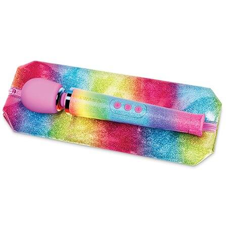 Le Wand Rainbow Ombre Petite Wand Massager laying on top of the matching, zippered bag that comes with the wand. The two of them are almost twins in coloration and glossy shine. | Kinkly Shop