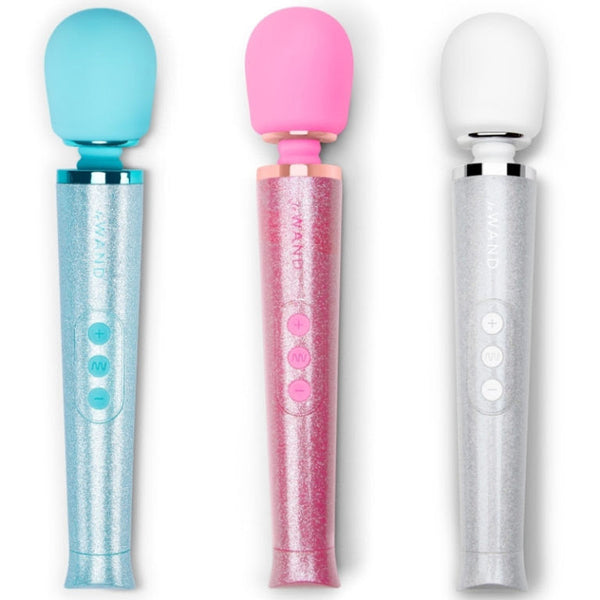All three Le Wand All That Glimmers Wand Massager color options sitting out right next to one another on a flat, white surface. This allows a quick comparison of the different colors at a glance. | Kinkly Shop