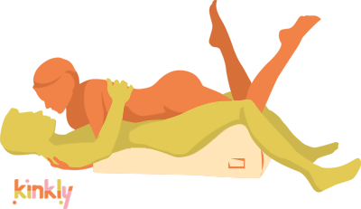 Illustration shows the Liberator Hipster in use. The penetrating partner is laying on top of the Hipster. The Hipster's curves elevates the laying partner's hips to a perfect angle for new intercourse angles. The receiving partner lays on top. | Kinkly Shop