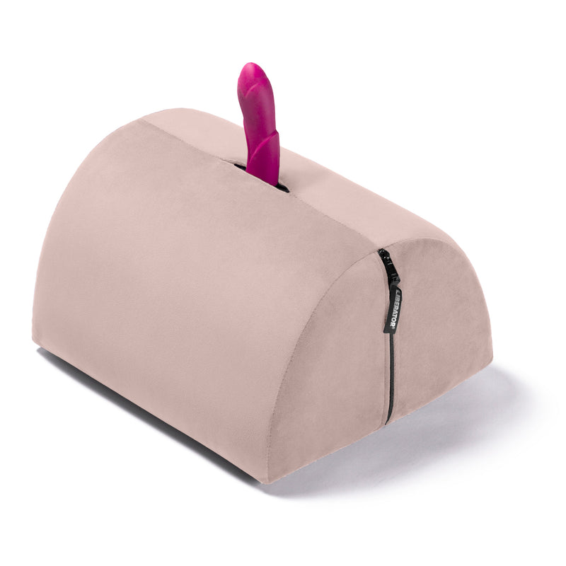 Liberator BonBon Sex Toy Mount in Rose. A sex toy is sticking out of the sex toy mount hole to showcase how the BonBon holds your favorite sex toys, hands-free. | Kinkly Shop