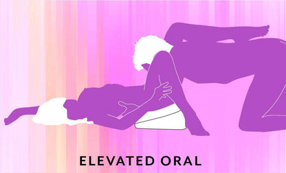 Illustrated sex position called "Elevated Oral". The receiving partner is laying on their back with their hips elevated by the Liberator Heart Wedge. Their feet rest flat on the ground with their thighs spread. The giving partner is kneeling in front of them to give them oral sex. | Kinkly Shop