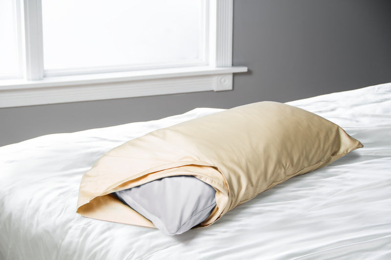 Liberator Humphrey in grey slid into a yellow pillowcase to show its ability to be discreet sex furniture | Kinkly Shop