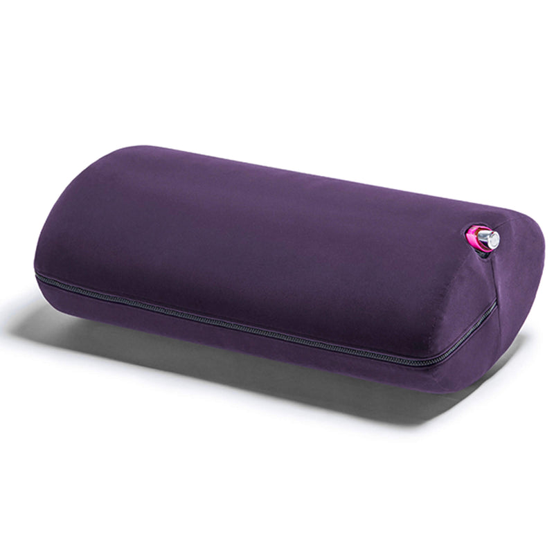 Liberator Wing in Aubergine. A sex toy is inserted into the sex toy mount's hole on the side of the shape. Only the base of the vibrator is visible as the vibrator vibrates the entirety of the Wing's size. | Kinkly Shop