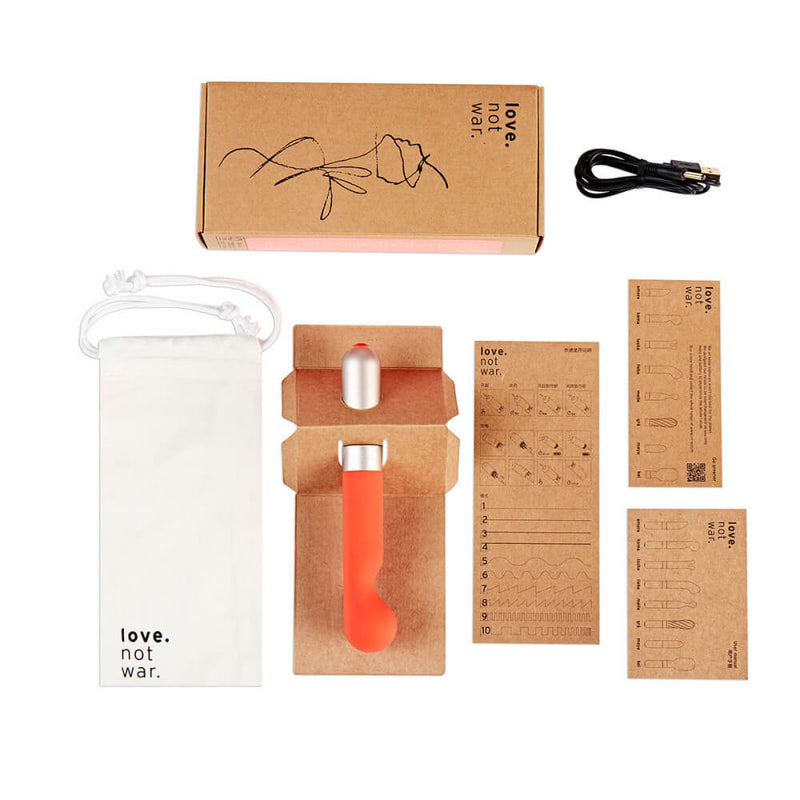 Everything included with the Love Not War Kama. This showcases the cardboard-focused packaging - which even includes cardboard instructions! The Love Not War Kama also comes with a cotton drawstring storage bag and a charging cable. | Kinkly Shop