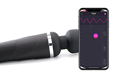 GIF shows the Lovense Domi 2 wand massager laying out next to a cell phone. A person is dragging the live-control button on the app to control the vibrations in real-time with a graphic responds to the movement of the dragging finger. The text reads "Fully programmable". | Kinkly Shop