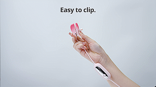 GIF of the Lovense Gemini remote control nipple clamps. A person is holding one of the clamps in their hand. They are opening and closing it easily, and the text on the GIF reads "Easy to clip. Adjust the tightness as you prefer." | Kinkly Shop