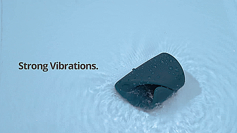 GIF of the Lovense Gush. The Gush is resting in a pool of water. Vibrations are turned on, and the water is splashing everywhere. The text on the GIF reads "Strong Vibrations." | Kinkly Shop