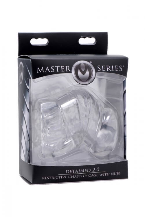 Packaging for the Master Series Detained 2.0 Restrictive Chastity Cage. The packaging is standard black and silver "Master Series" packaging with a large, clear window in the front to view the cage. | Kinkly Shop