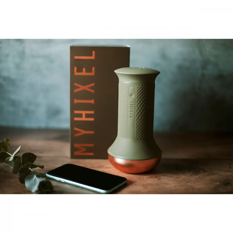 A moody picture shows the MyHixel TR premature ejaculation sex toy sitting in front of the packaging | Kinkly Shop
