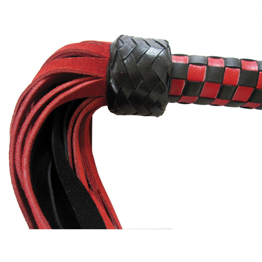 Another close-up image of the Ruff Doggie Styles Short Suede Flogger shows the different in texture between the super-soft looking suede tails and the shiny, sturdy leather handle braiding | Kinkly Shop