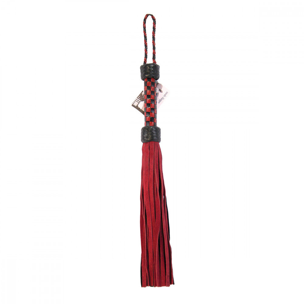 Ruff Doggie Styles Short Suede Flogger laying flat to show the bedroom flogger length | Kinkly Shop