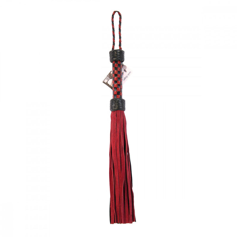 Ruff Doggie Styles Short Suede Flogger laying flat to show the bedroom flogger length | Kinkly Shop