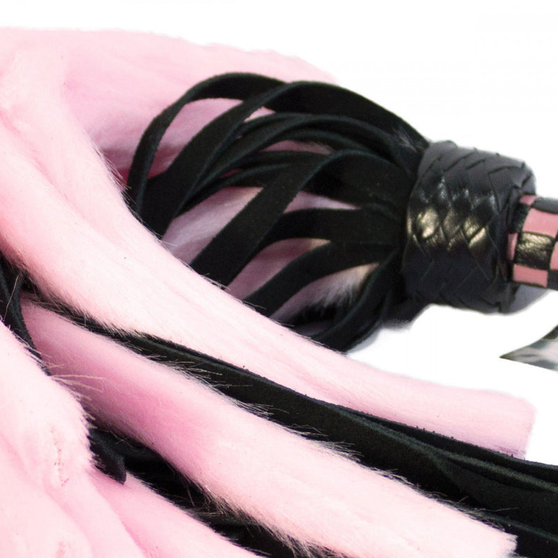 Another detail shot of the pink Ruff Doggie Styles Suede and Fluff Mini Flogger which shows the fluffiness of the faux fur tails | Kinkly Shop
