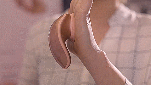 GIF shows a person's flat palm. The Shots Twitch Innovations is pressed up firmly up against their palm and is adhering to the palm, hands-free, from the power of the suction in the vibrator. | Kinkly Shop