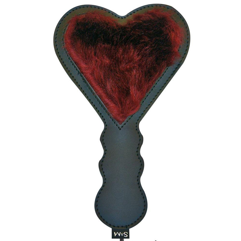 Front side of the Sportsheets Enchanted Heart Paddle. You can see the heart-shaped cut out on this paddle where the deep red faux fur shows through the spanking paddle. The grooves in the handle make for easier gripping. | Kinkly Shop