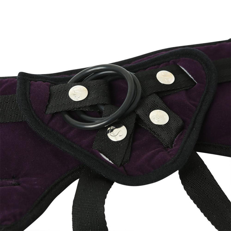Close-up of the O-ring area of the Sportsheets Lush Purple Strap On Harness. The picture shows all of the O-rings snapped into the O-ring panel at once. This close-up of the panel also shows how the O-rings snap in. | Kinkly Shop