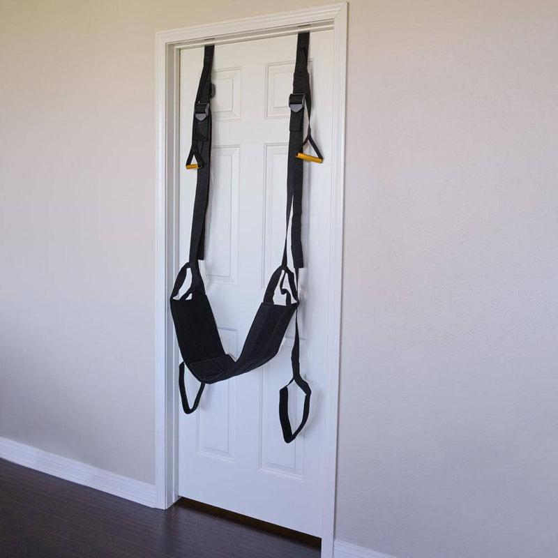 The Sportsheets Door Jam Sex Sling Special Edition plus size sex swing hanging from a door. This shows the relative size compared to the door (takes up most of the doorframe width) as well as how simple installation is. | Kinkly Shop