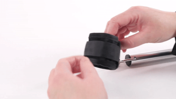 GIF shows a person unvelcro'ing a cuff - then using the clip attached to the cuff to fasten the spreader bar to the Sportsheets Expandable Spreader Bar & Cuff Set | Kinkly Shop