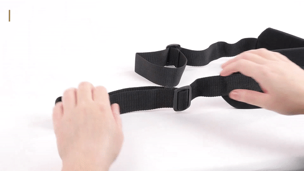GIF shows a person inserting their hand into the adjustable loop and tightening it on the Sportsheets I Like It Doggie Style Strap | Kinkly Shop