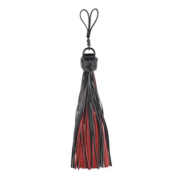 The Sportsheets Saffron Finger Flogger up against a white background. With the tails splayed out, it showcases how the tails are both red and black. There's a braided knot that connects all of the tails together near the finger loops. | Kinkly Shop
