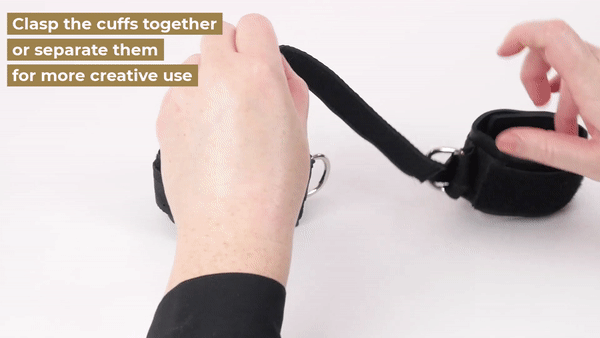 GIF shows a person threading one of the cuff's velcro fastening straps through the D-ring of the opposite cuff - which fastens the Sportsheets Supercuffs to each other with no other hardware required! | Kinkly Shop