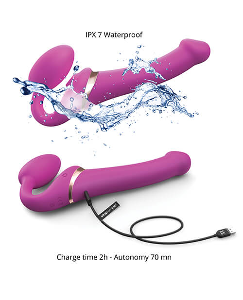 Two images of the Strap-on-Me Vibrating Licking Strapless Strap-on showcase some of its features. The top image shows a splash of water hitting the vibrator with the text "IPX 7 Waterproof". The bottom image shows the Strap-on-Me Vibrating Licking Strapless Strap-on hooked up to the charger with the text "Charge Time 2 Hour. Use Time 70 Minutes". | Kinkly Shop