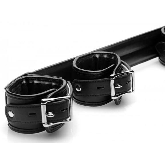 Close up of the cuffs of the STRICT Spreader Bar. The image shows the locking buckle that each one of the cuffs has. | Kinkly Shop