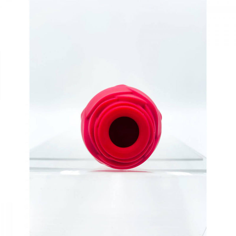 Looking directly into the tip of the open air suction whole of the Suckle Rose Vibrator. | Kinkly Shop