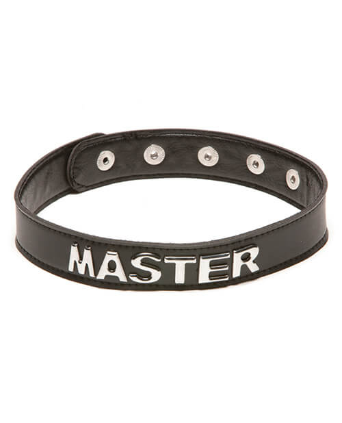 Master Talk Dirty to Me Collar. It's a slend, black collar that has multiple snap closures on the backside of the collar. On the front, the collar's text has the word written out in silver capital letters. | Kinkly Shop