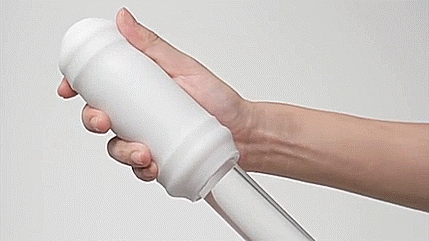 GIF shows the Tenga 3D inside out, with the geometric design on the inside of the stroker. The person holding the stroker is attempting to slide it down a glass dildo to show on how works in use. | Kinkly Shop