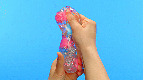 GIF of two hands holding the Tenga Bobble. They are pushing and squeezing the stroker to showcase how the firmer, internal shapes can be pushed around for masturbation play. | Kinkly Shop