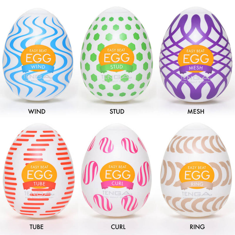 Tenga Egg Wonder variety pack. Six colorful, bright Tenga Eggs are laid out on top of a white background. The colorful patterns on the packaging match the texture found within each stroker. The kit includes Wind, Stud, Mesh, Tube, Curl, and Ring. | Kinkly Shop