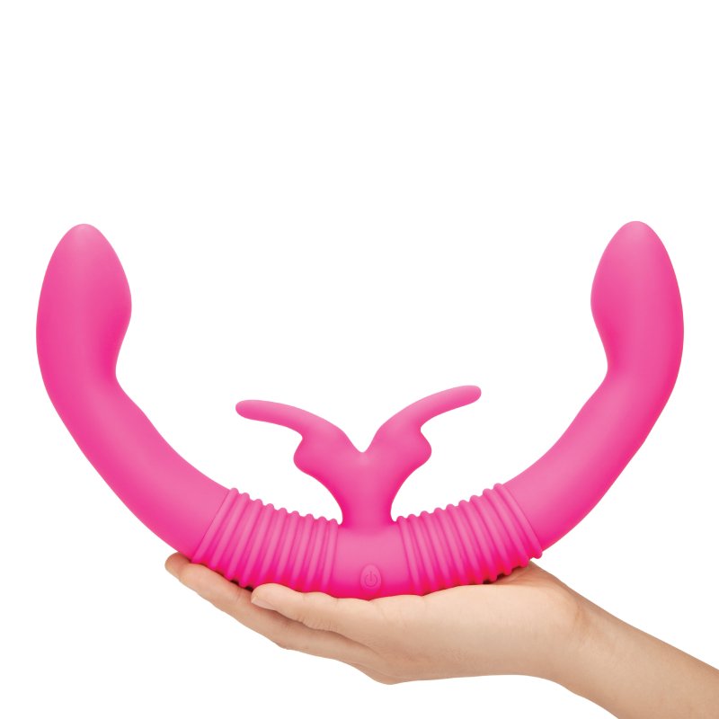 A hand is shown holding the Together Toy Shared Vibrator for Couples. The vibrator is noticeably larger than the person's hand. | Kinkly Shop