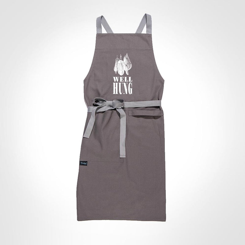 Lay-flat image of the Twisted Wares Well-Hung Apron which shows the adjustable 60" apron waist tie, equipped large pocket, and towel loop | Kinkly Shop