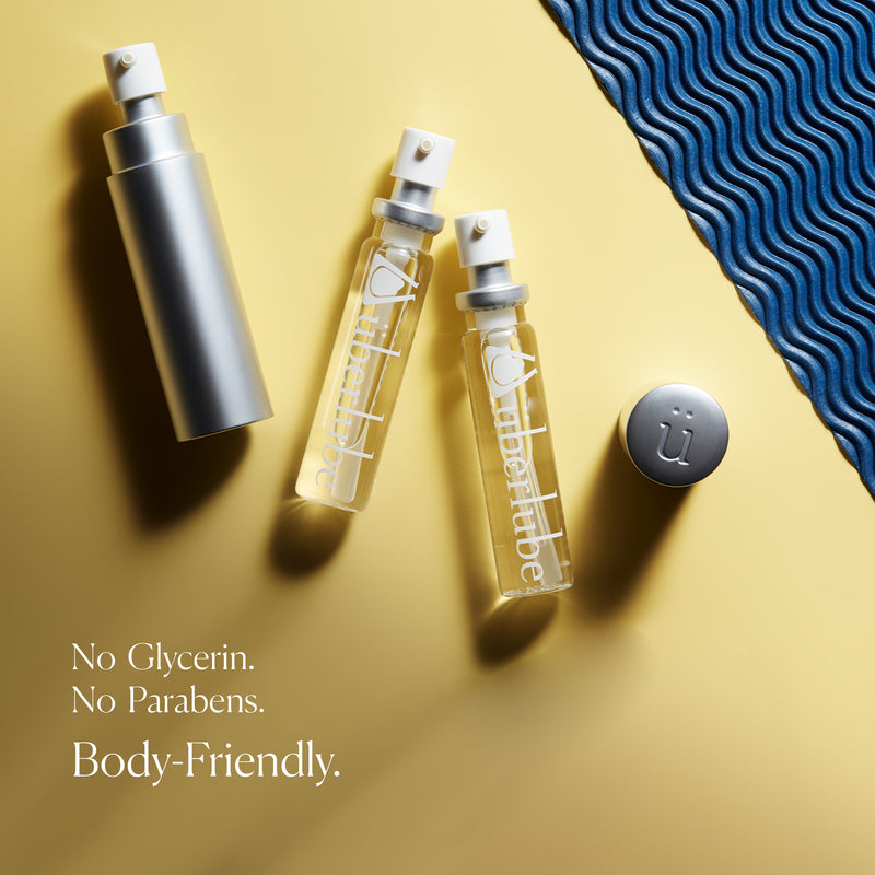 Überlube Good-to-Go Travel Size Lube bottles lay on top of a yellow background. Words on the image read "No glycerin. No parabens. Body-friendly." | Kinkly Shop