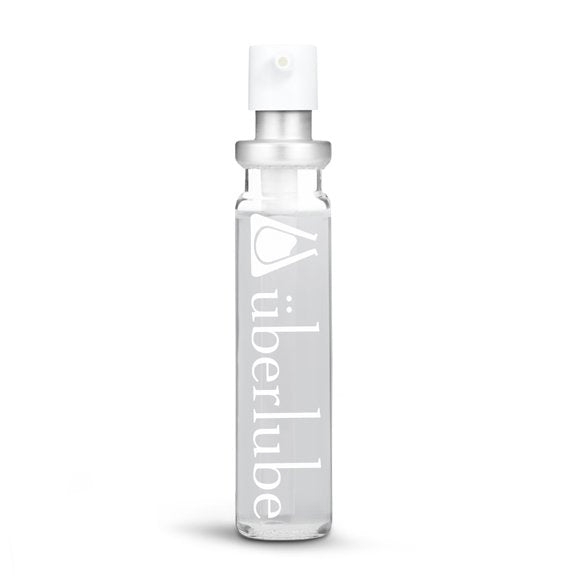 Überlube Good-to-Go Travel Size Lube in 15ml without the Good-To-Go Travel Lube Case around it. It's a see-through glass bottle with "Uberlube" printed in large print along the length. | Kinkly Shop