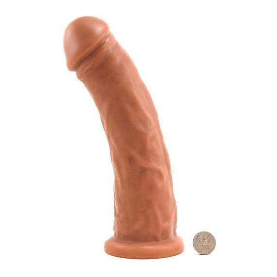 Vixen Creations Gambler in Caramel. Next to this giant dildo is a quarter for scale. The quarter looks like it's 1/20th in height compared to the dildo. | Kinkly Shop