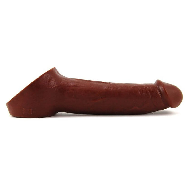 Side view of the Vixen Creations Ride-On. This angle showcases the realistic look of the extender with the large, wide strap that wraps around the testicles for comfort during wear. | Kinkly Shop