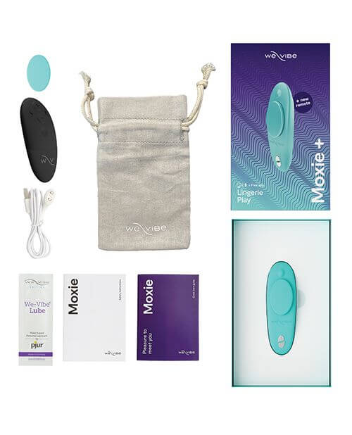 We-Vibe Moxie+ Panty Vibe in aqua laying out with everything that comes with the panty vibrator. This includes the panty vibrator itself, an extra backing magnet, the black physical remote control, a cotton straw-colored drawstring bag, the magnetic charging cable, a sample-sized packet of water-based lube, an instruction manual, and safety instructions. | Kinkly Shop