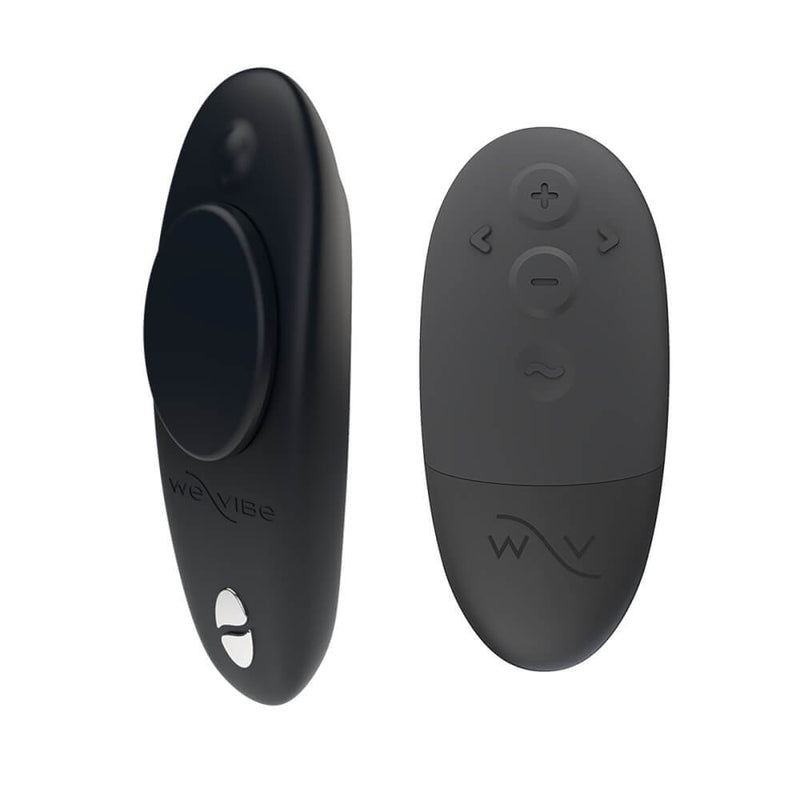 The We-Vibe Moxie+ Panty Vibe in Black sitting next to the black physical remote that it comes with. The vibrator is a deeper, midnight black while the remote is a very dark grey. | Kinkly Shop