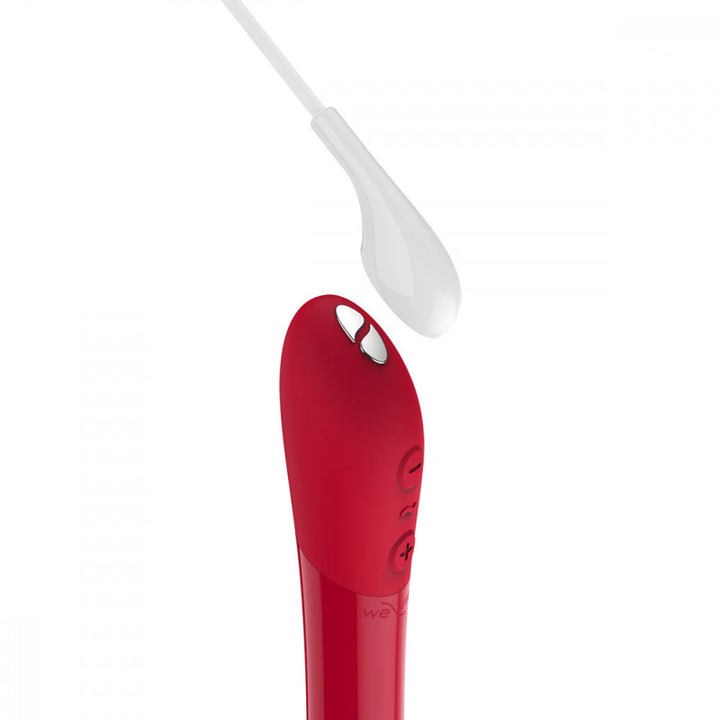 Image shows the magnetic charger hovering near the We-Vibe Tango X about to attach to this rechargeable waterproof bullet vibrator | Kinkly Shop
