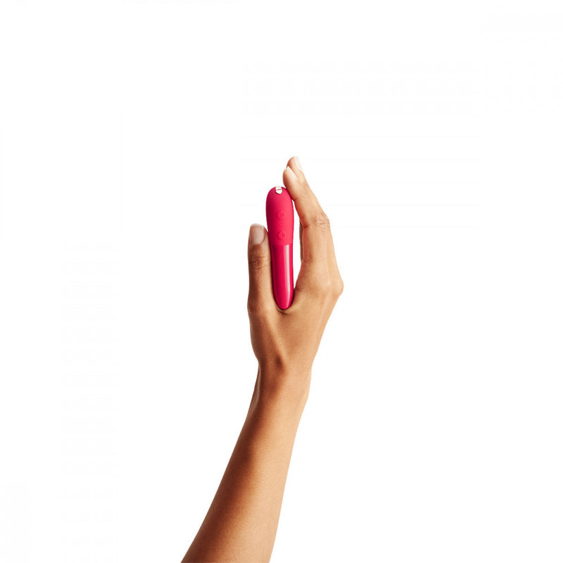 A hand holding the small We-Vibe Tango X pink bullet vibrator | Kinkly Shop