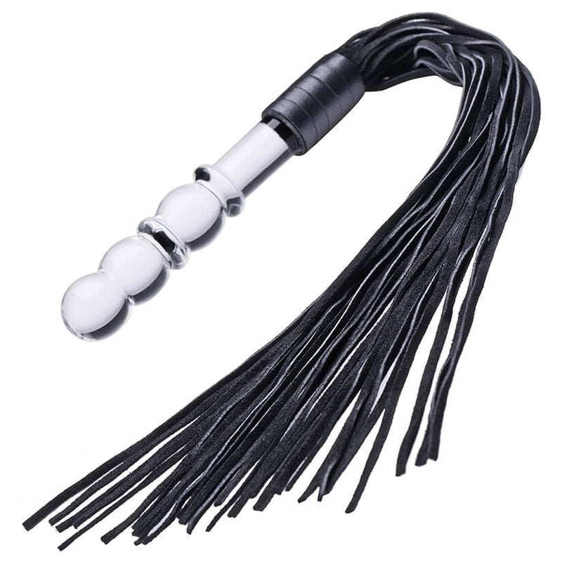 Lingam Glass Dildo Flogger in front of a white background. The handle includes multiple bulbs that make it easier to handle and make it more pleasurable as an insertable toy. The suede tails look lightweight. | Kinkly Shop
