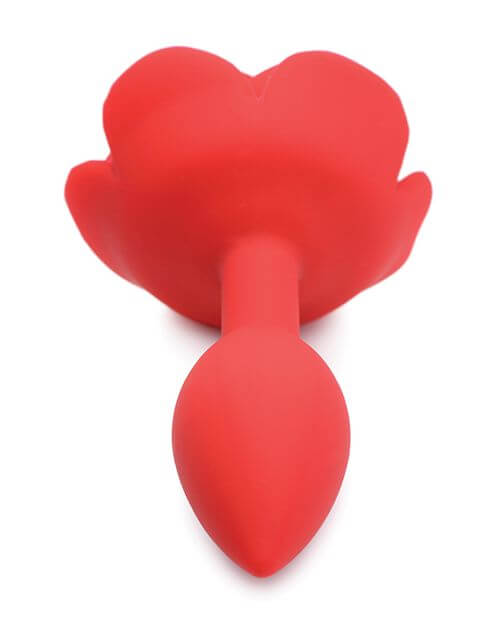 A close-up photo of the Master Series Booty Bloom tip. This showcases the extremely-tapered tip of the plug that will make it easier to insert. The thick, wide rose functions as the base of the toy. | Kinkly Shop