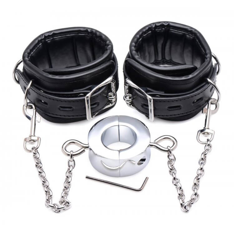 Master Series Hell's Tether Ball Stretcher Humbler sitting out next to the two padded cuffs. This shows how all of the pieces work together. The locking buckles on the cuffs are visible, and the single-sided clips can be found at the end of each of the ball stretcher chains. | Kinkly Shop