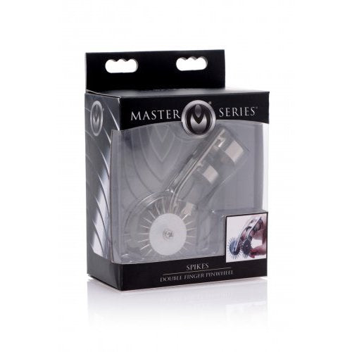 The XR Brands Spikes Double Finger Pinwheel inside of its packaging. The packaging is black and silver and says "Master Series" on it. It is a clear, see-through box that clearly showcases the product inside the box. | Kinkly Shop