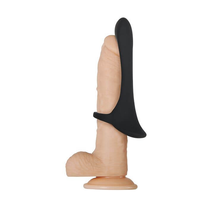 The Zero Tolerance Cock Armor shown attached to a dildo. The Zero Tolerance Cock Armor is worn half-way down the shaft, protruding over the tip of the dildo. It only has a single ring at the base of the Zero Tolerance Cock Armor that holds it onto the shaft, allowing it to be worn any place along the shaft. | Kinkly Shop